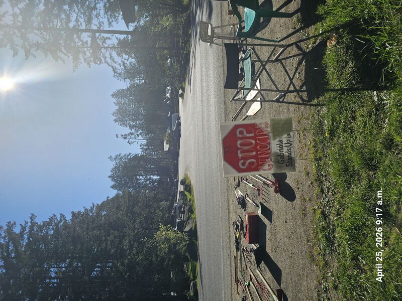 Stop Genocide sign outside Nesters Market, Gabriola Island